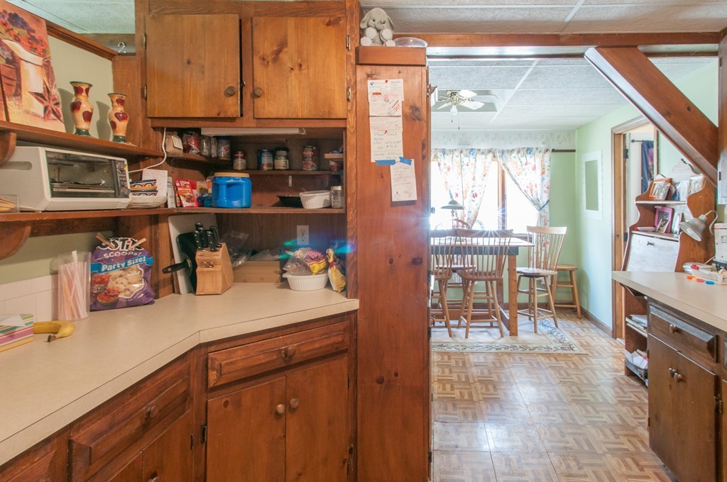 451 Silver Lake Road Hollis, NH 03049 - Photo 11 of 29 a kitchen with stainless steel appliances granite countertop a sink and cabinets