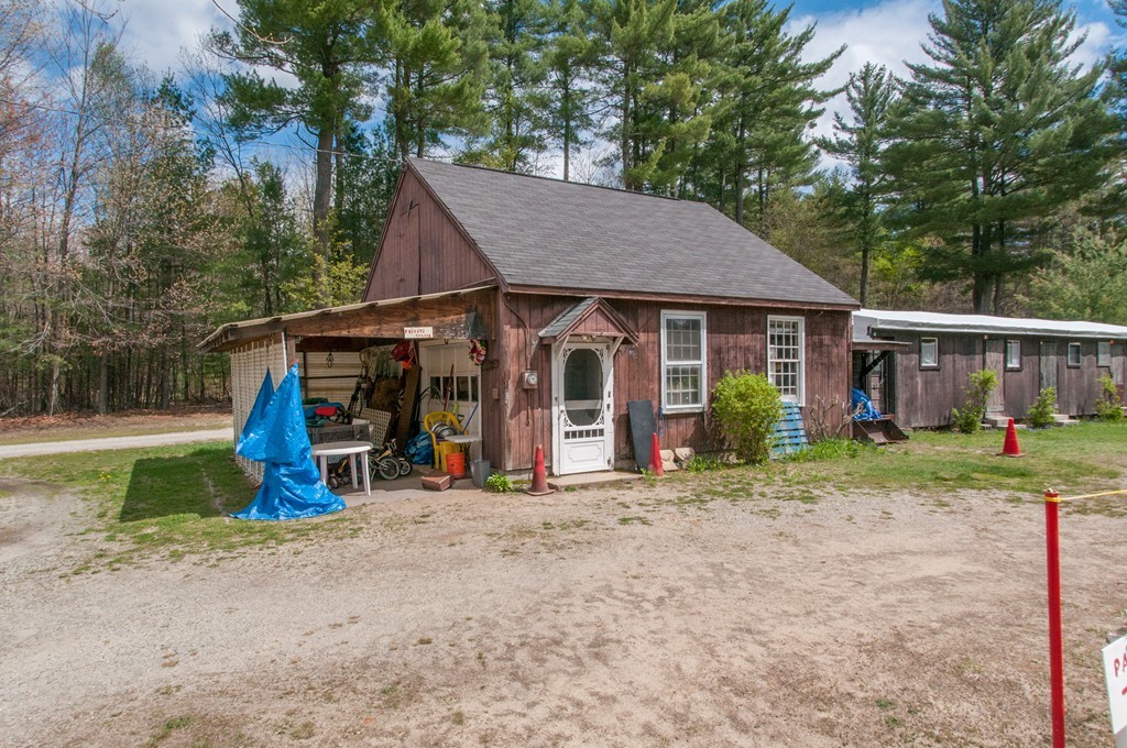 451 Silver Lake Road Hollis, NH 03049 - Photo 3 of 29 a view of a house with a yard and trees