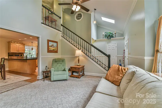 a bedroom with two beds and a chandelier