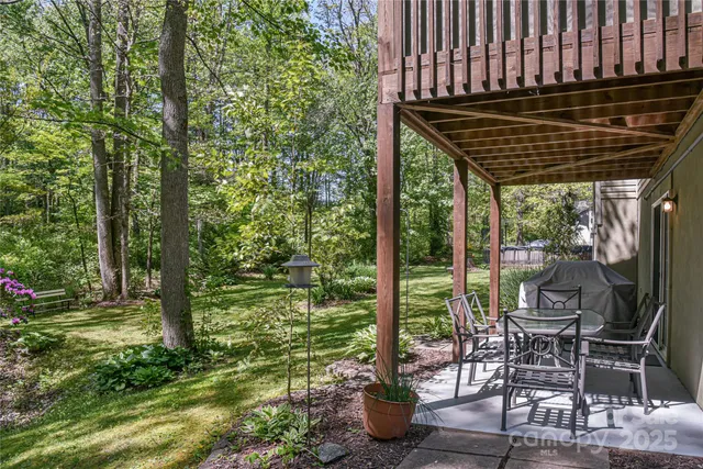 a kitchen with stainless steel appliances granite countertop a refrigerator a stove and a sink