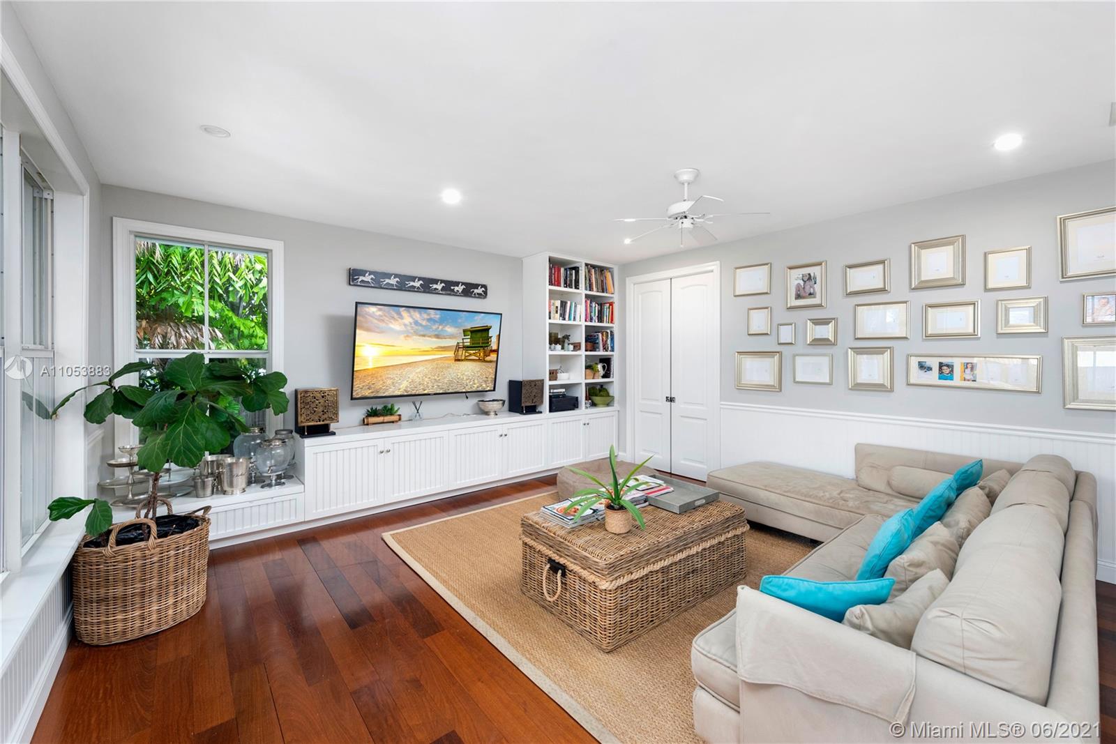 280 Woodcrest Road Key Biscayne, FL 33149 - Photo 15 of 41 a living room with furniture and a flat screen tv