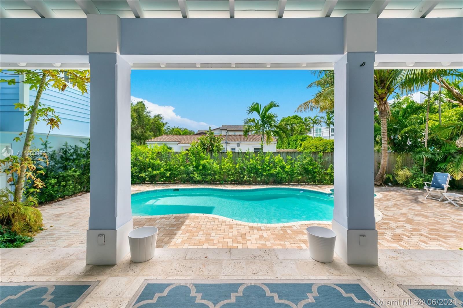 280 Woodcrest Road Key Biscayne, FL 33149 - Photo 16 of 41 a couple of potted plants in front of door