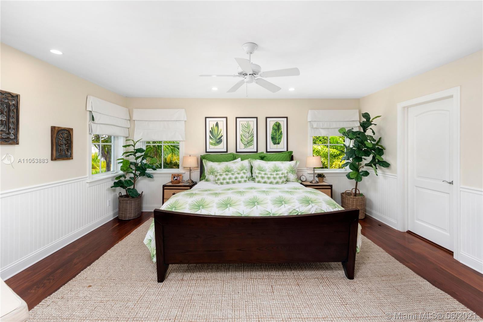 280 Woodcrest Road Key Biscayne, FL 33149 - Photo 20 of 41 a bed sitting in a spacious bedroom next to a window