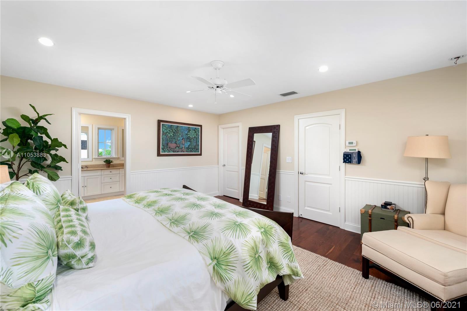 280 Woodcrest Road Key Biscayne, FL 33149 - Photo 22 of 41 a spacious bedroom with a bed and a couch