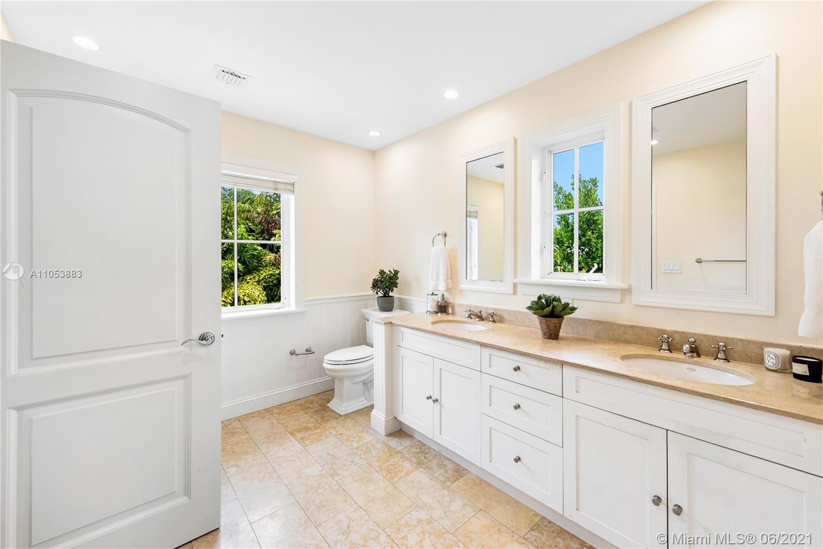 280 Woodcrest Road Key Biscayne, FL 33149 - Photo 23 of 41 a bathroom with a granite countertop sink mirror and a toilet