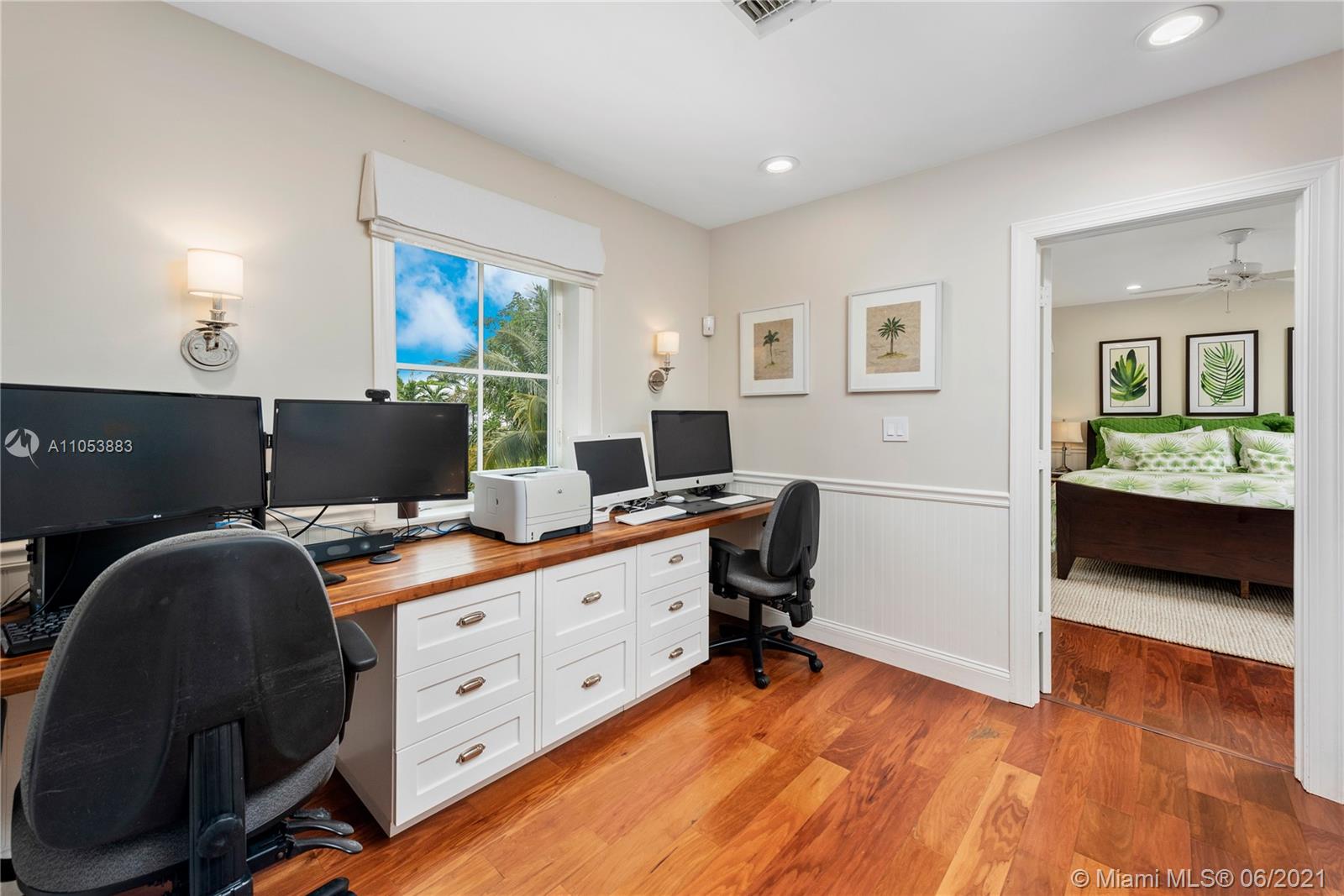 280 Woodcrest Road Key Biscayne, FL 33149 - Photo 25 of 41 a view of a workspace with furniture and a window
