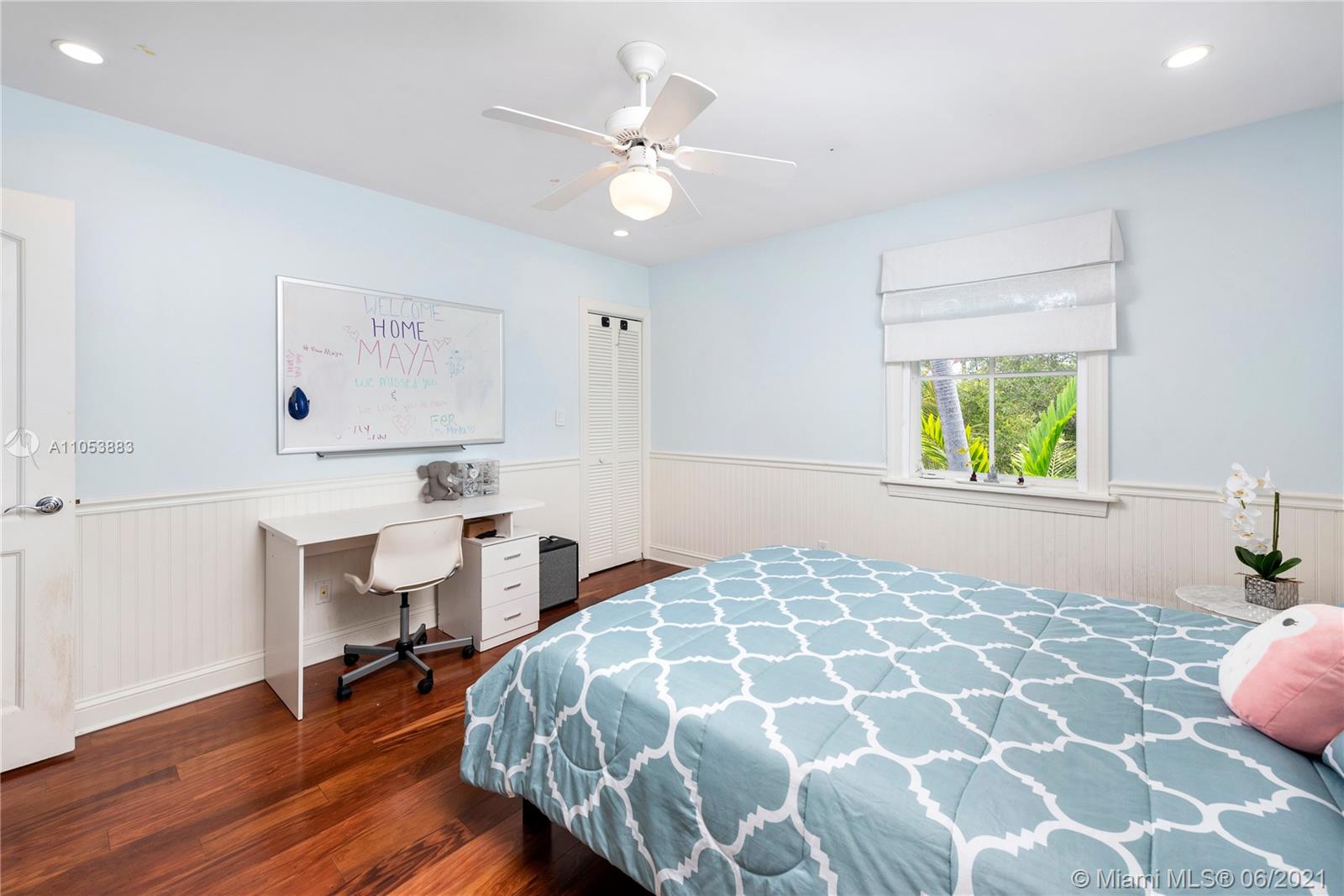 280 Woodcrest Road Key Biscayne, FL 33149 - Photo 27 of 41 a bedroom with a bed and a table in it