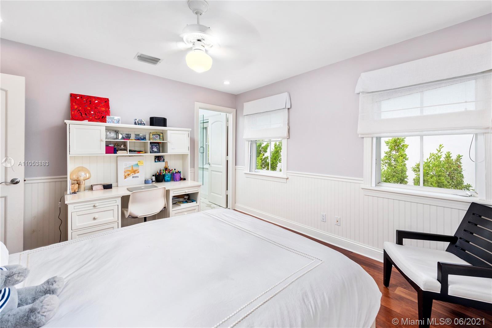 280 Woodcrest Road Key Biscayne, FL 33149 - Photo 30 of 41 a bedroom with a bed dresser and a window