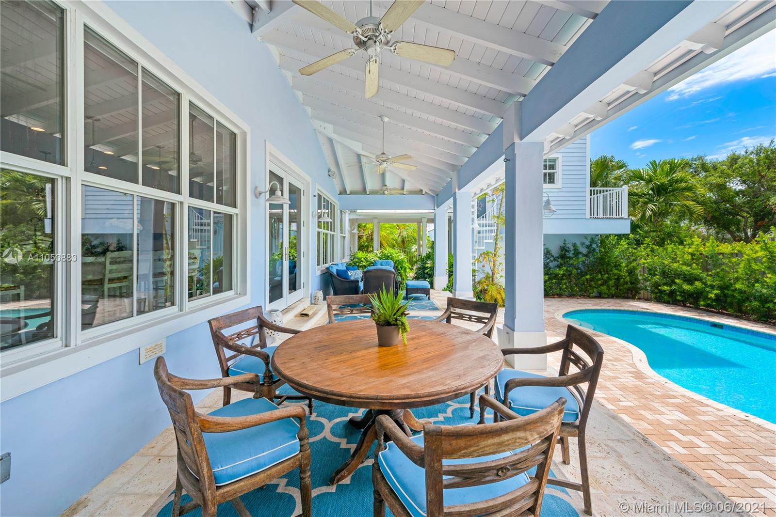 280 Woodcrest Road Key Biscayne, FL 33149 - Photo 33 of 41 a patio with yard table and chairs