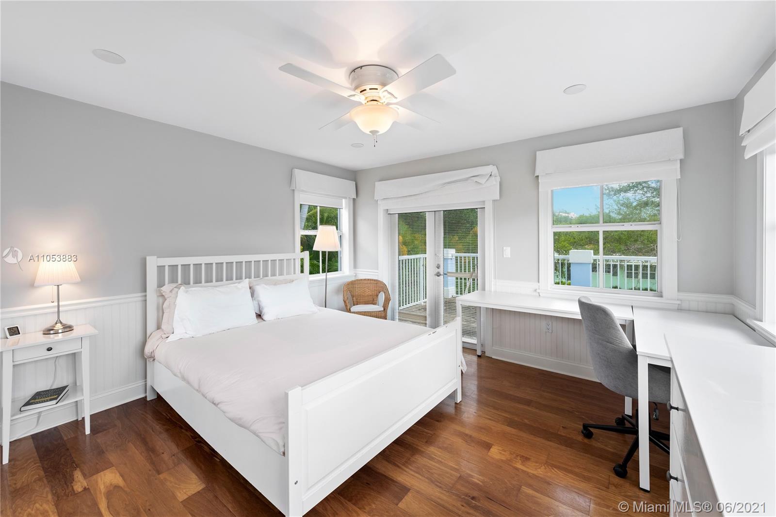280 Woodcrest Road Key Biscayne, FL 33149 - Photo 34 of 41 a bed room with a bed and a table