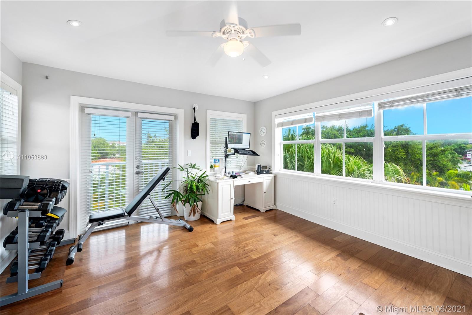 280 Woodcrest Road Key Biscayne, FL 33149 - Photo 38 of 41 a view of a livingroom with furniture a ceiling fan and a window