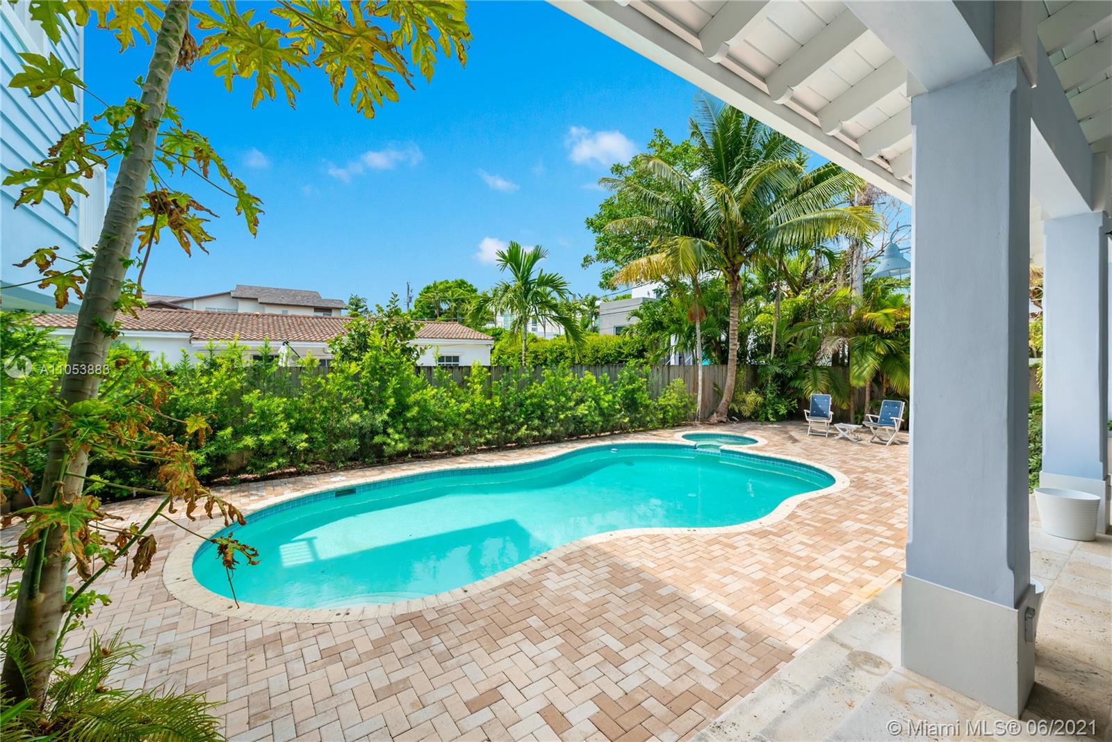280 Woodcrest Road Key Biscayne, FL 33149 - Photo 39 of 41 a view of a swimming pool with a yard and plants