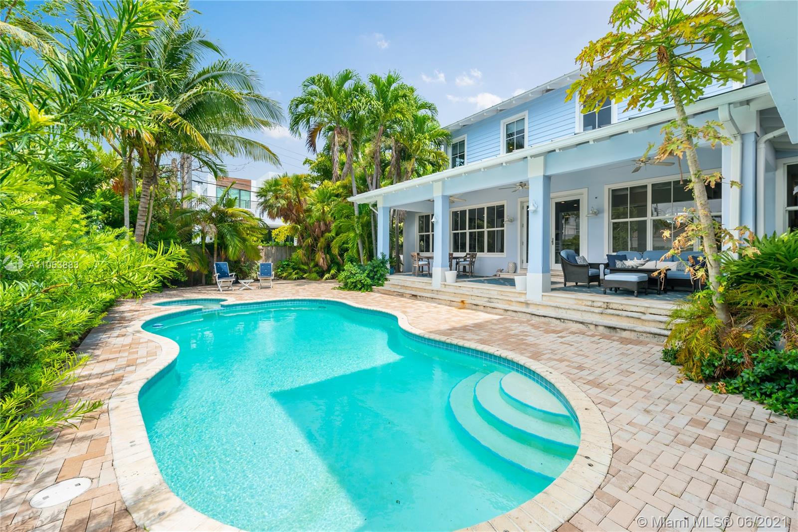 280 Woodcrest Road Key Biscayne, FL 33149 - Photo 40 of 41 a swimming pool with outdoor seating and yard