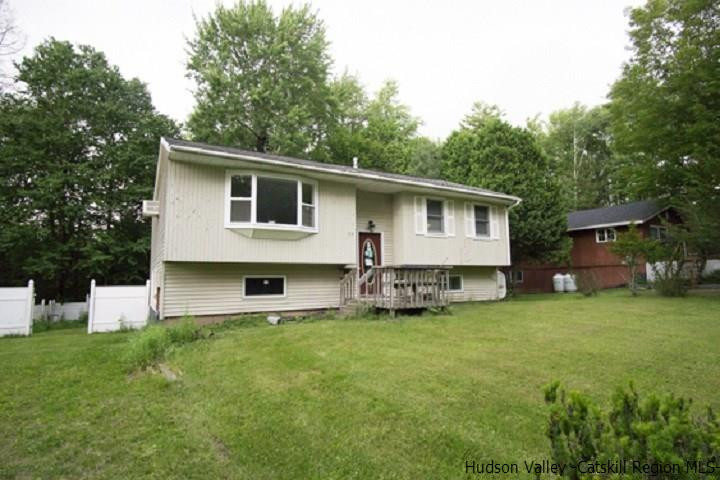 35 Aster Road Loch Sheldrake, NY 12759 - Photo 5 of 11 a view of a house with a yard and sitting area