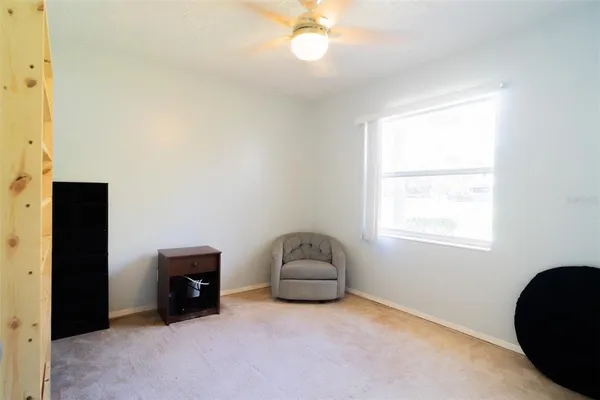 a room with a window and a chair