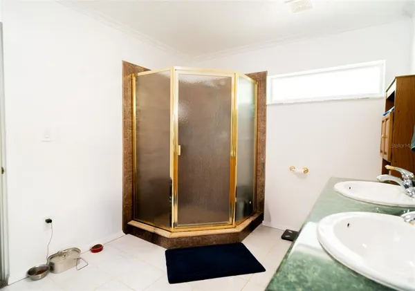 a bathroom with a tub and a shower