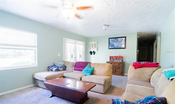 a living room with furniture and a window