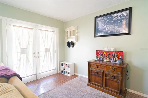 a view of a livingroom with furniture and a window