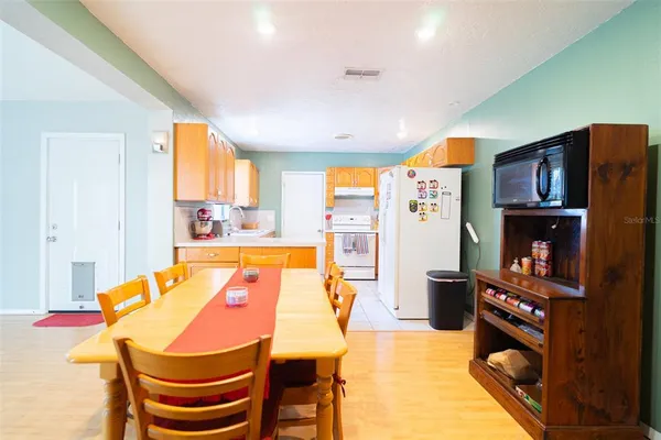 a dining room with a table and chairs