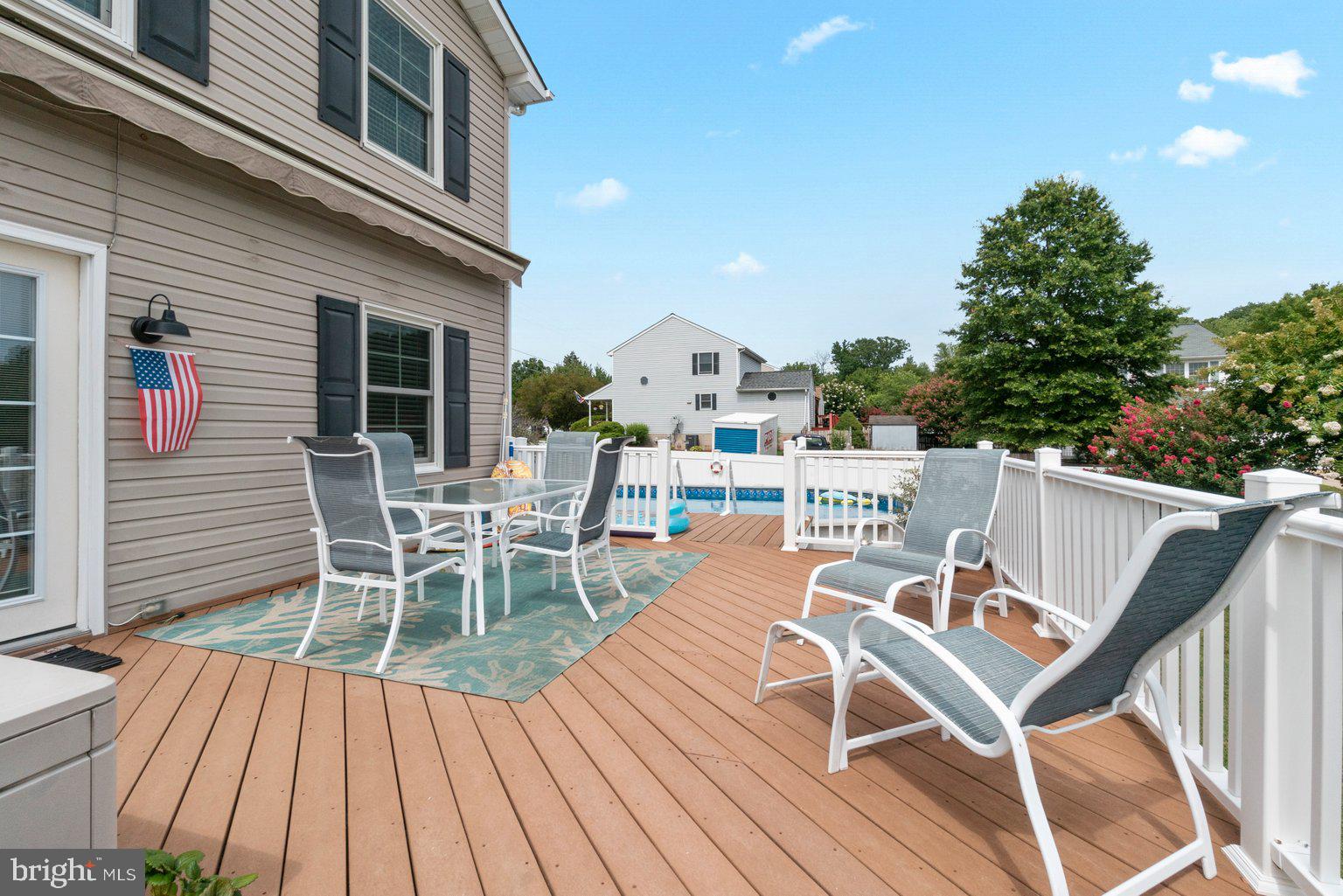 1617 Cape May Road Baltimore, MD 21221 - Photo 18 of 37 a view of a patio with table and chairs couches with wooden floor and fence