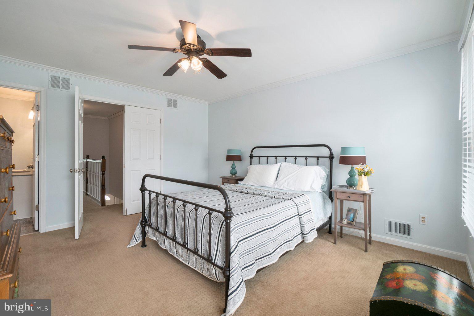 1617 Cape May Road Baltimore, MD 21221 - Photo 23 of 37 a bedroom with a bed and a chandelier
