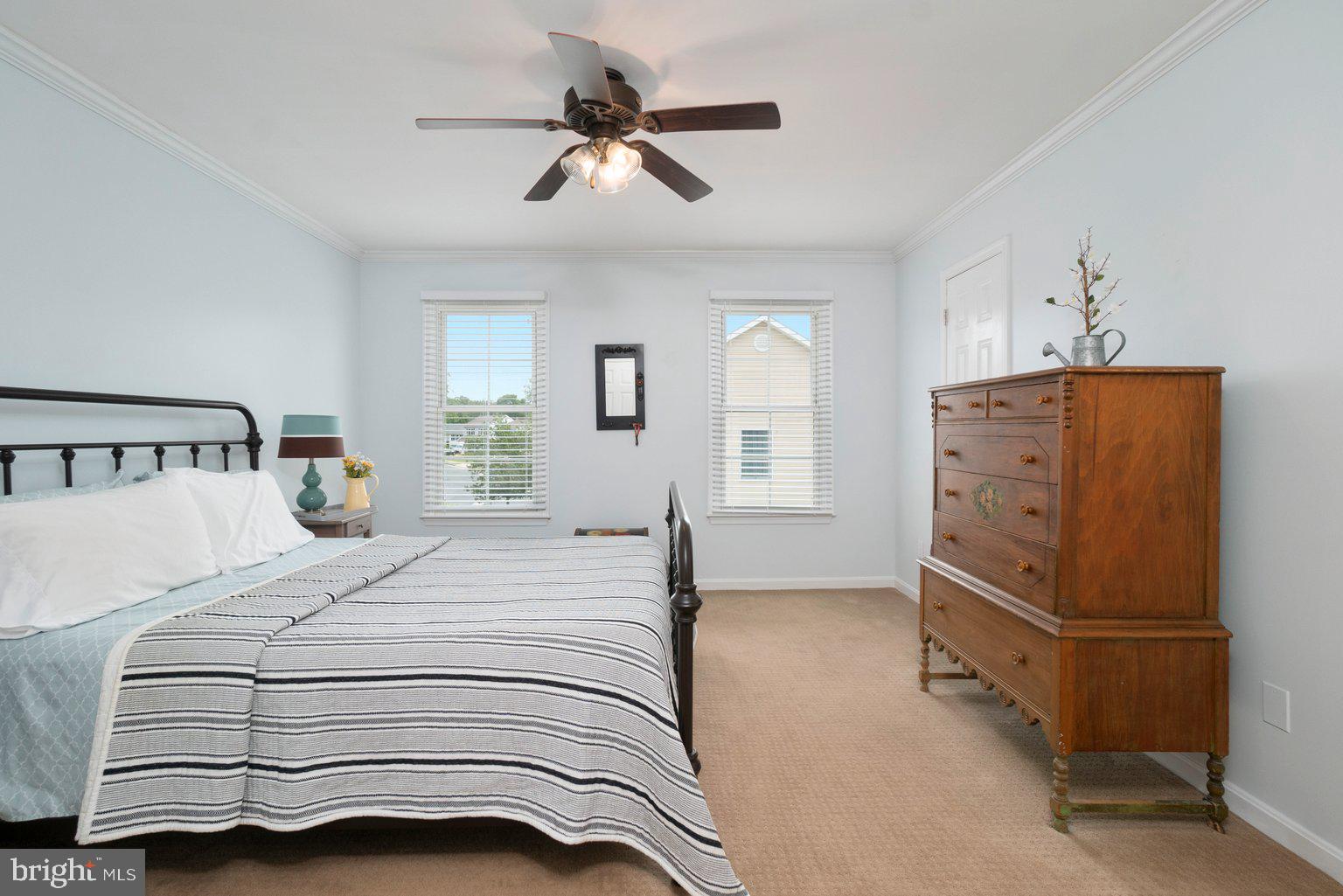 1617 Cape May Road Baltimore, MD 21221 - Photo 24 of 37 a bedroom with a bed and a chandelier