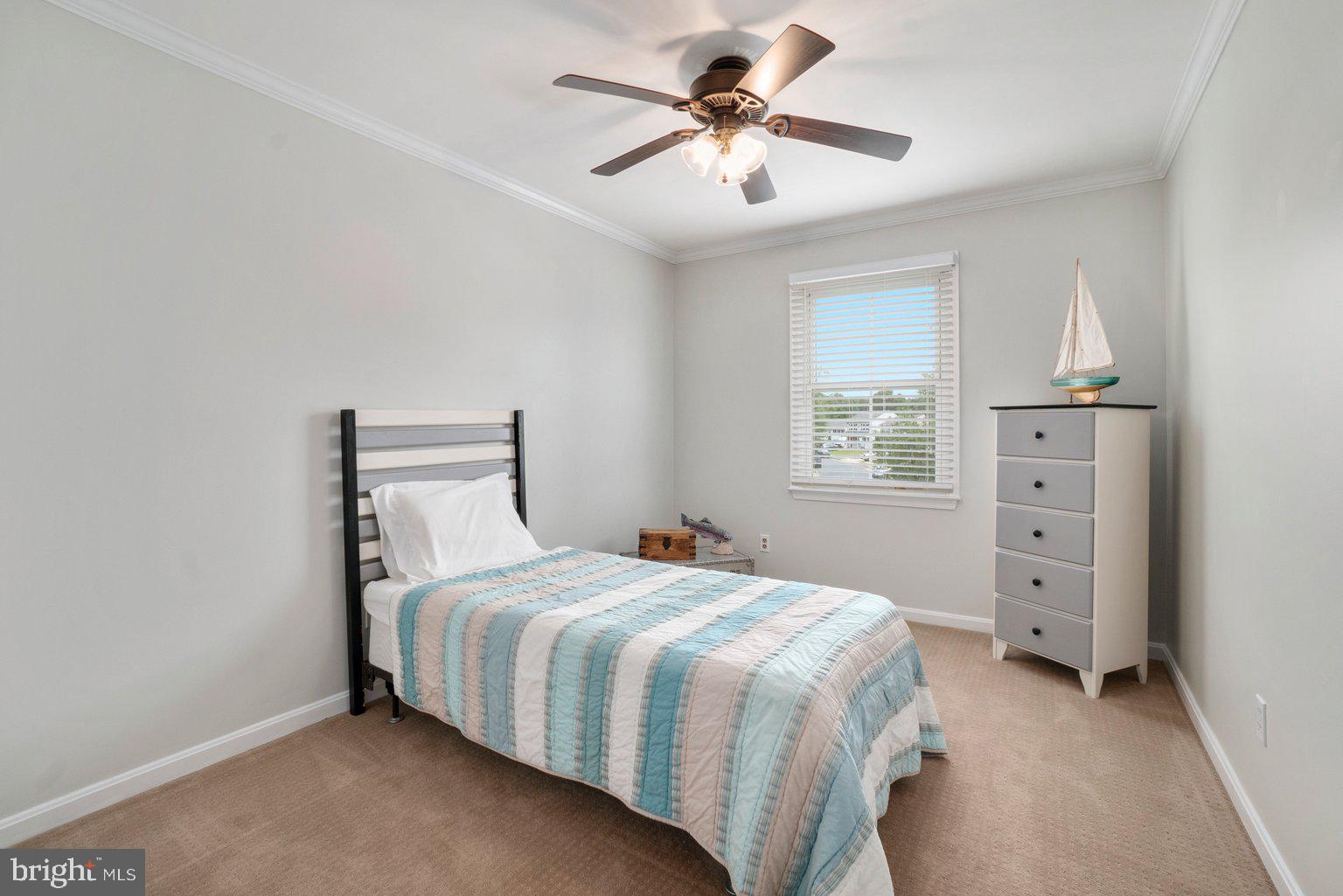1617 Cape May Road Baltimore, MD 21221 - Photo 29 of 37 a bedroom with a bed and a chandelier