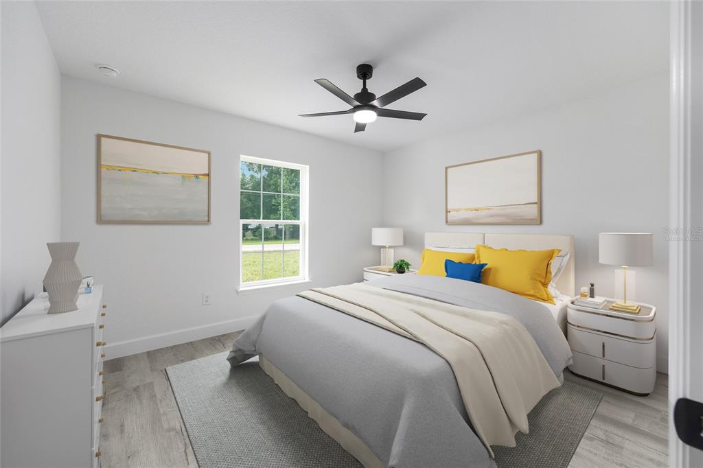 6052 Northwest 53rd Street Road Ocala, FL 34482 - Photo 7 of 26 a bedroom with a bed and a window