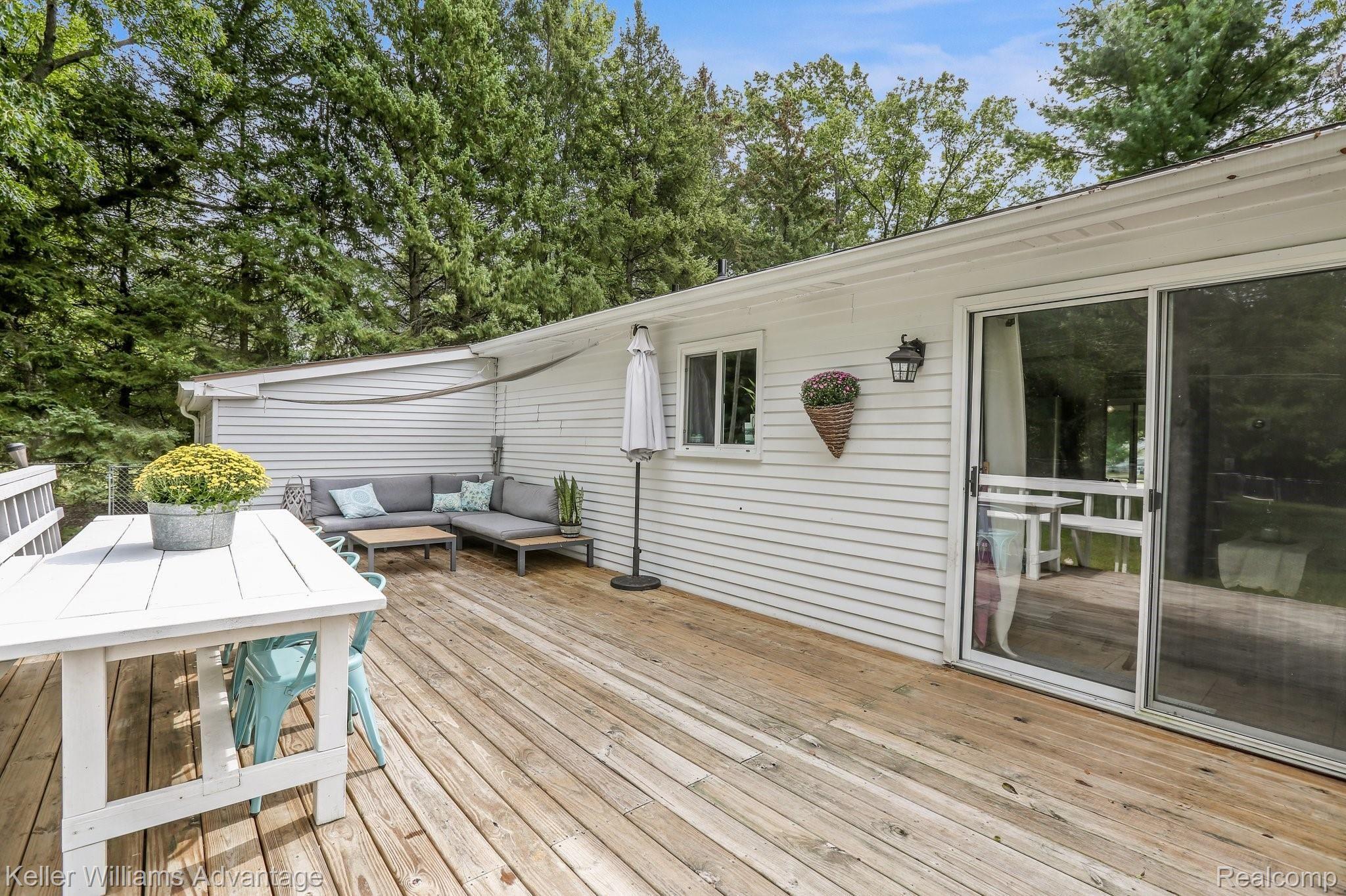 2636 Potter Road Wixom, MI 48393 - Photo 14 of 22 Large deck and built in table great for entertaining