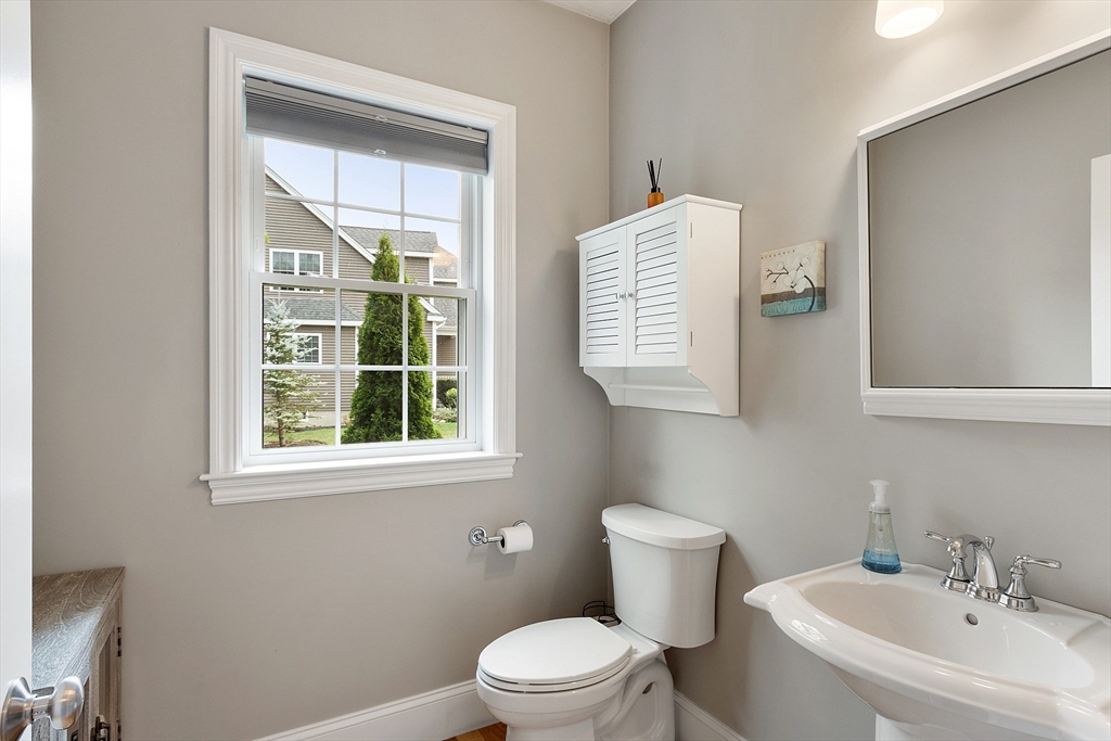 46 Jordan Road Holden, MA 01520 - Photo 15 of 42 a white toilet sitting next to a bathroom sink