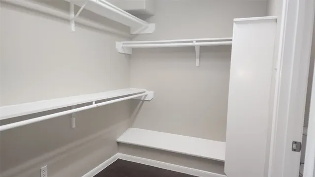 a view of an empty walk in closet