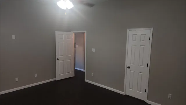 an empty room with closet area