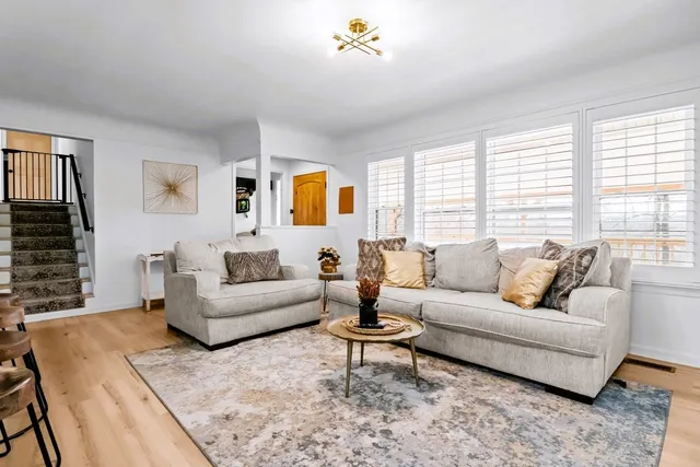 a kitchen with stainless steel appliances a stove microwave and cabinets