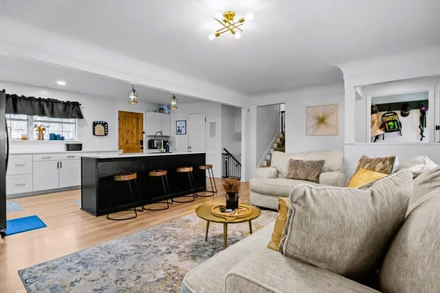 a kitchen with stainless steel appliances a refrigerator and cabinets