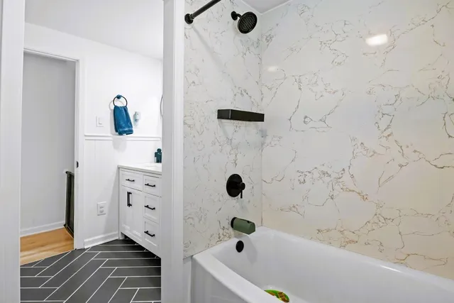 a view of a dinning room with a bench in patio