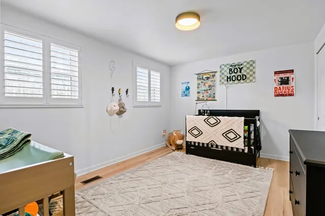 a view of a house with swimming pool and sitting area
