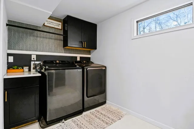 a kitchen with stainless steel appliances a stove a microwave and a refrigerator