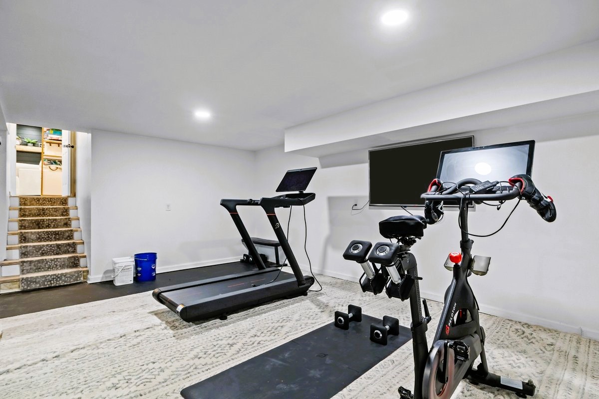 1975 Kelly Road Holladay, TN 38341 - Photo 45 of 88 a room with gym equipment and wooden floor