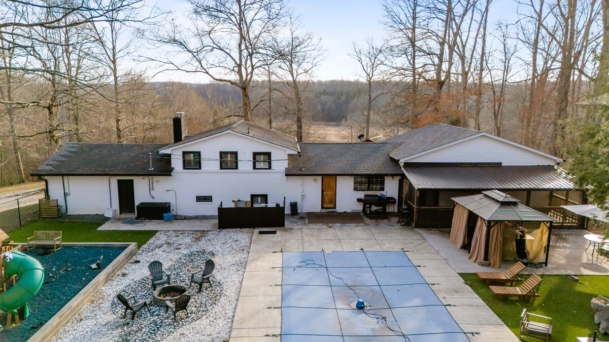 1975 Kelly Road Holladay, TN 38341 - Photo 5 of 88 a front view of house with yard barbeque and outdoor seating