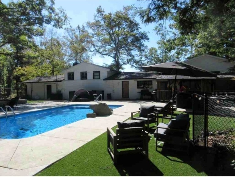 1975 Kelly Road Holladay, TN 38341 - Photo 56 of 88 a view of a house with swimming pool and sitting area