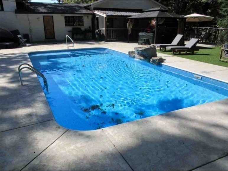 1975 Kelly Road Holladay, TN 38341 - Photo 57 of 88 a view of a swimming pool with a patio