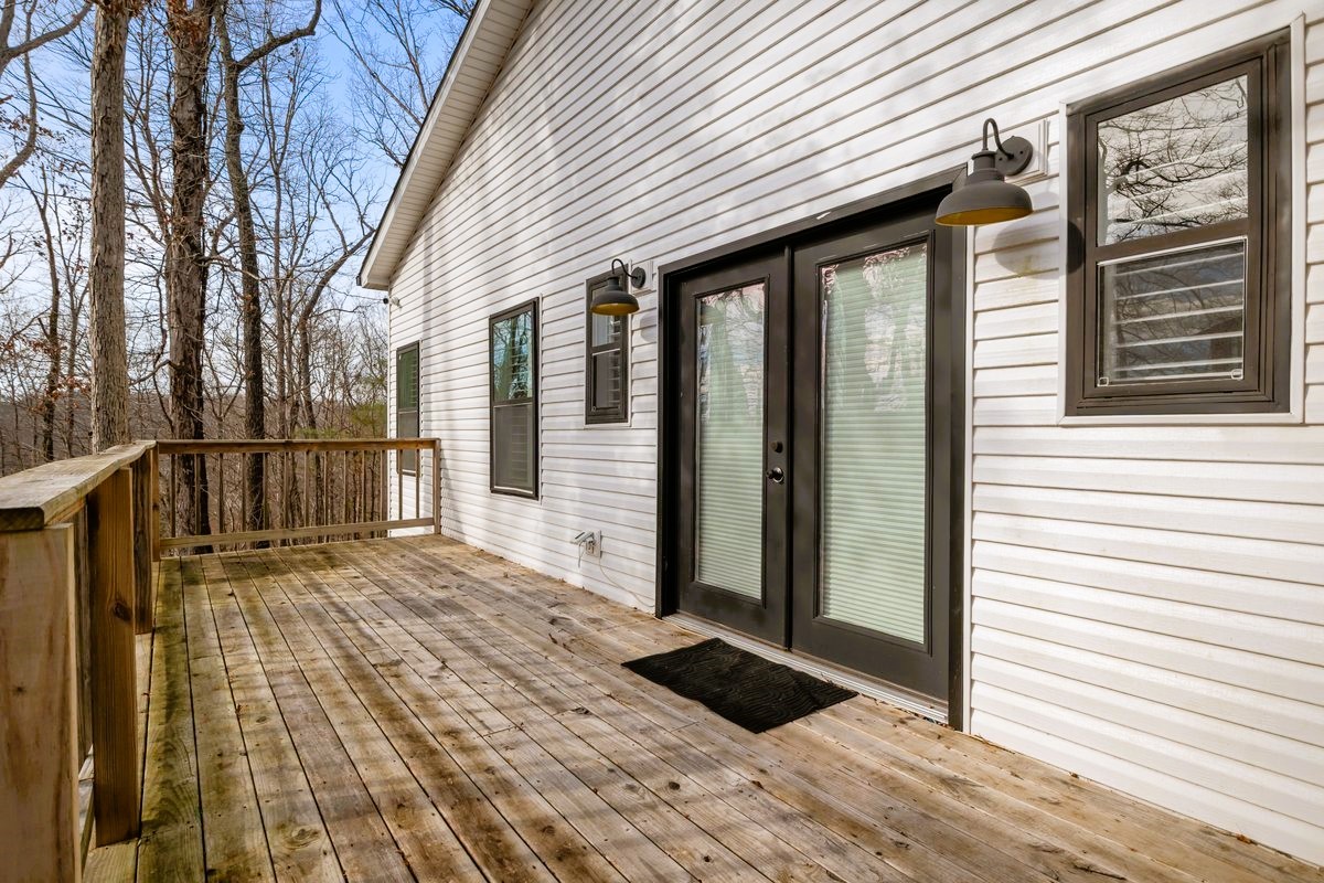 1975 Kelly Road Holladay, TN 38341 - Photo 6 of 88 a view of a house with a door and wooden floor