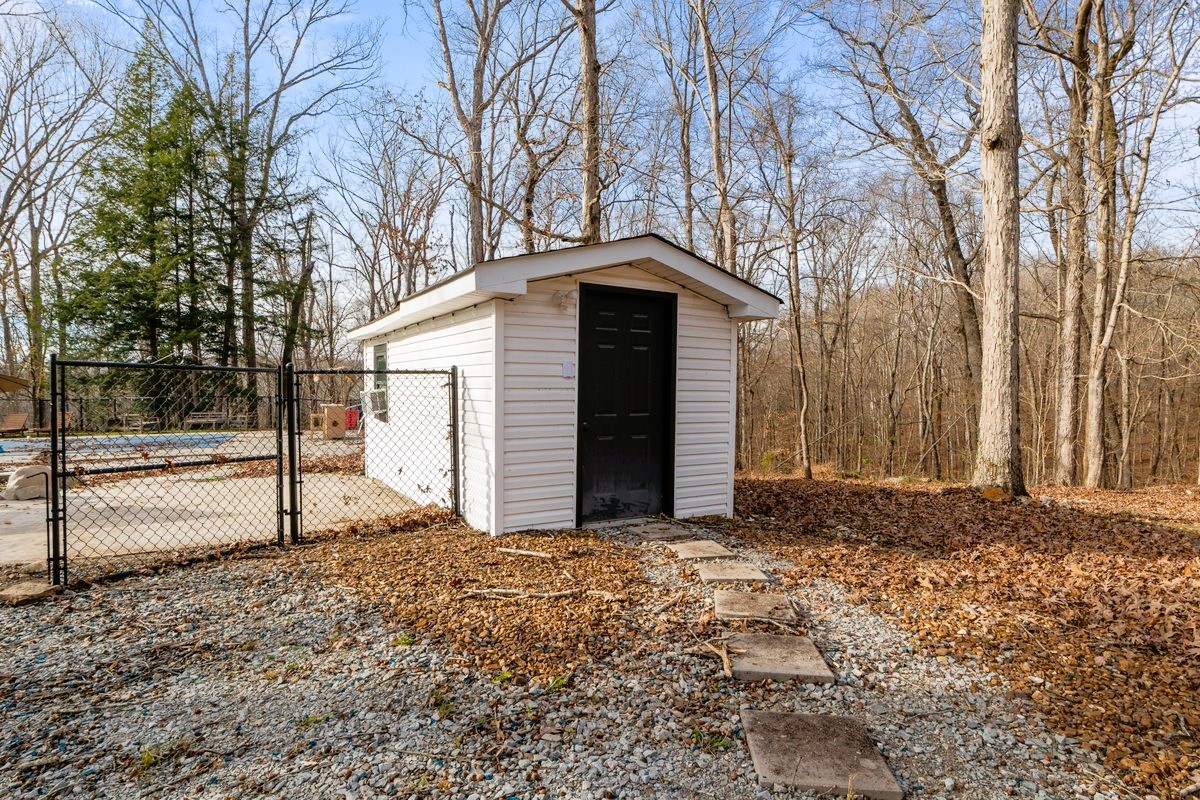 1975 Kelly Road Holladay, TN 38341 - Photo 64 of 88 a front view of a house with a yard
