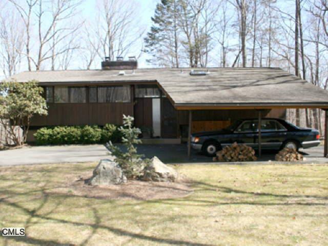 a view of a house with snow on the wall