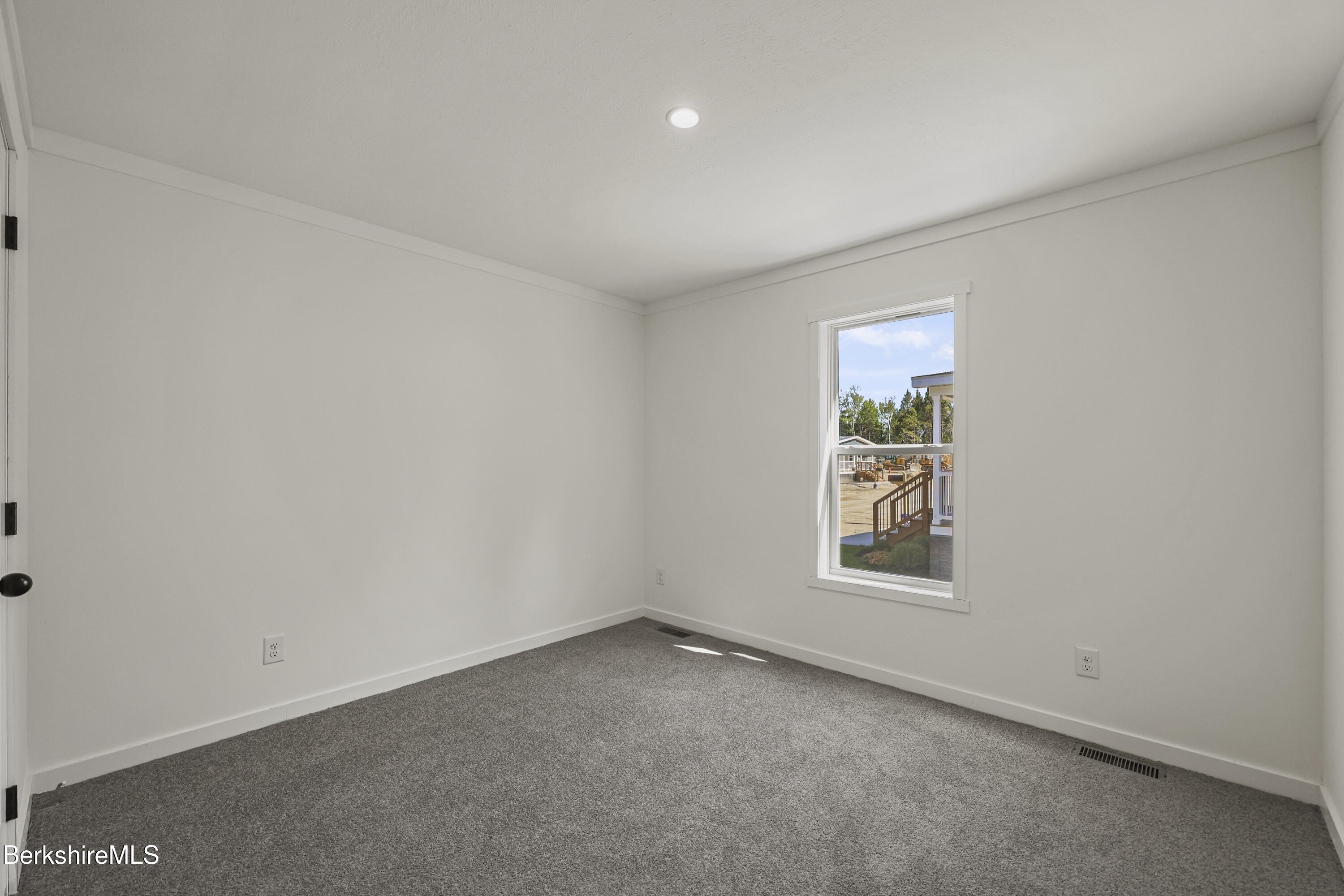 395 Cheshire Road, Unit 112 Pittsfield, MA 01201 - Photo 28 of 32 an empty room with windows