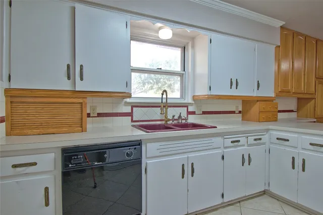 a kitchen with a stove and a microwave