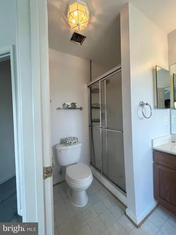 a bathroom with a toilet sink and shower