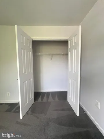 an empty room with a wooden door
