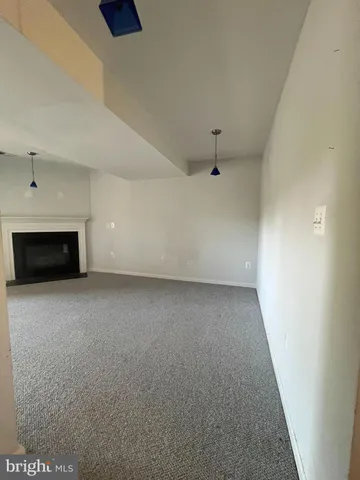 an empty room with a fireplace