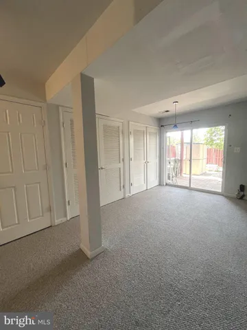 a view of empty room with windows